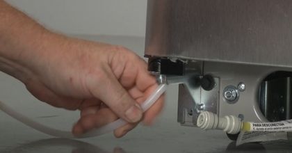 inserting a new water line in refrigerator door